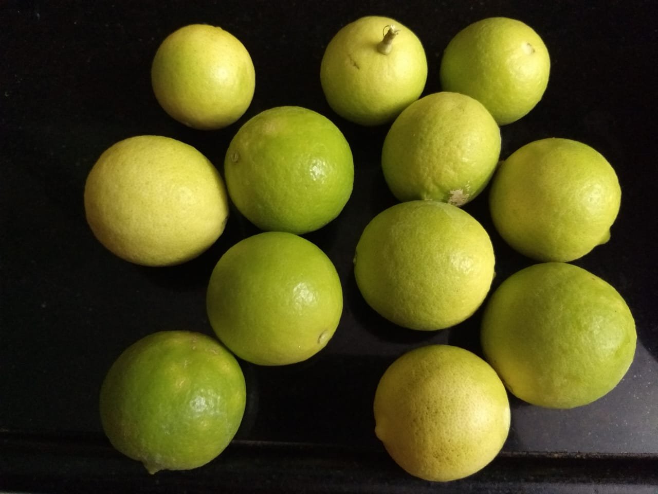 A green apple on top of a wooden counter

Description automatically generated